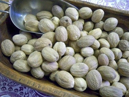 whole nutmeg in a bowl