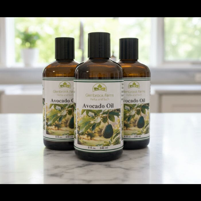 Three bottle of Avocado oil 8 ozs size sitting on a white counter