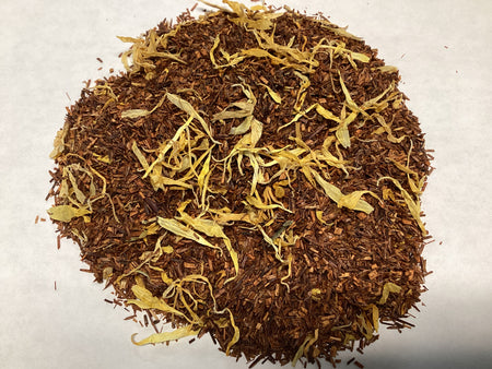 rooibos tea with calendula petals on a white background