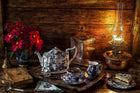 log cabil setting with a tea set and books , very cozy feel