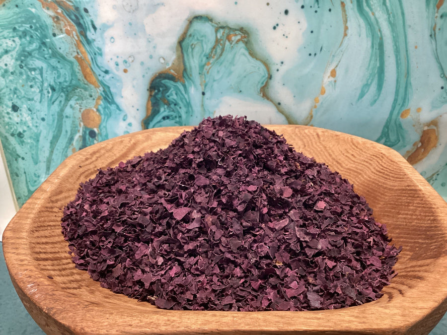 purple dried leaf dulse in a wooden bowl