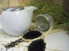 black tea with white teapot