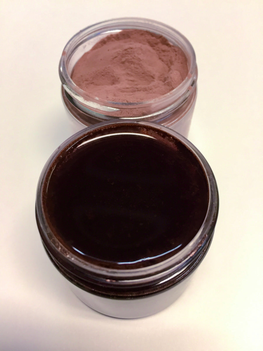 picture of  pinkish brown powder  and the  deep  black purple reconstituted juice that is made from this product 