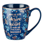 coffe mug  is dark blue with flowers with handle with Psalm 20:4 