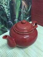red ceramic teapot 