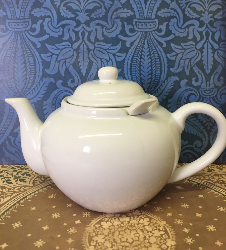 white ceramic teapot