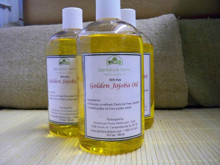 Golden jojoba oil in a bottle